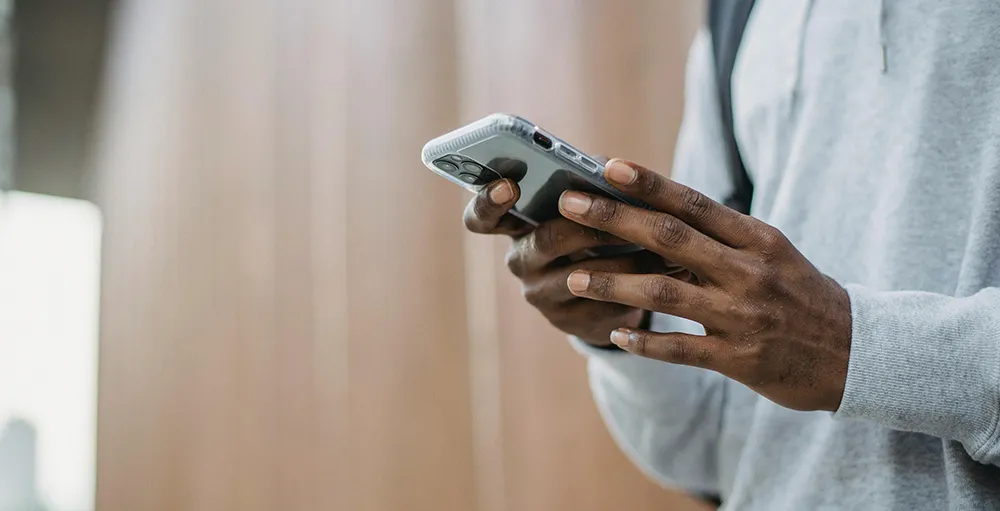 man watching videos on smartphone