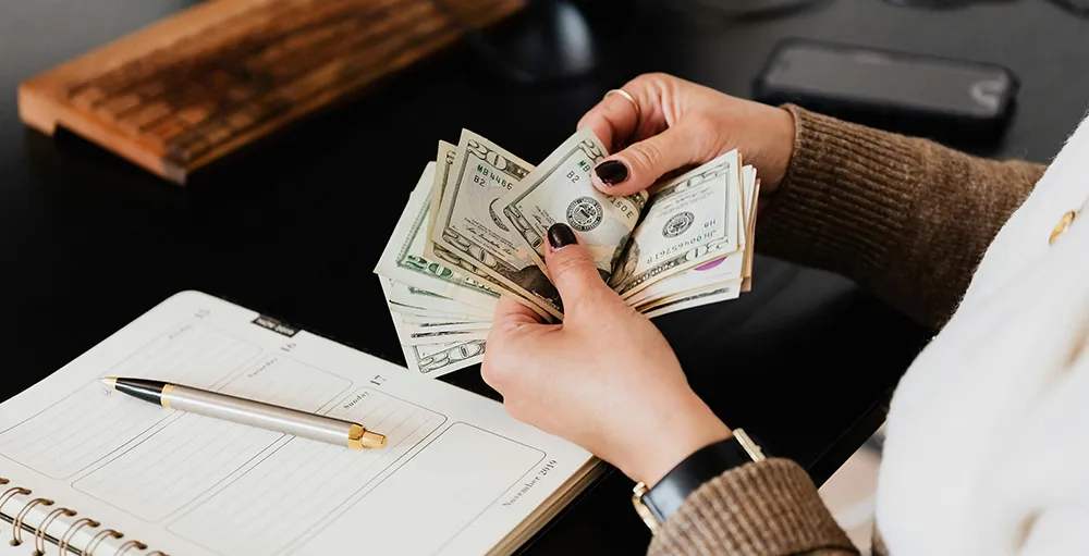 person counting cash