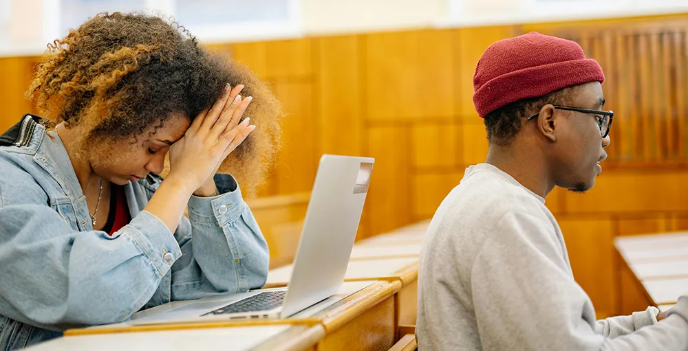 stressed students sitting in lecture hall