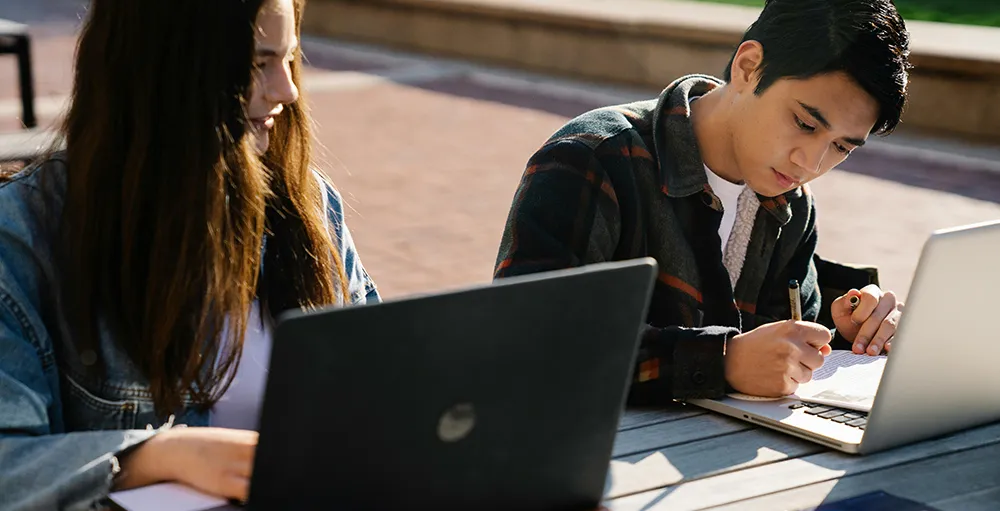 college students using laptop