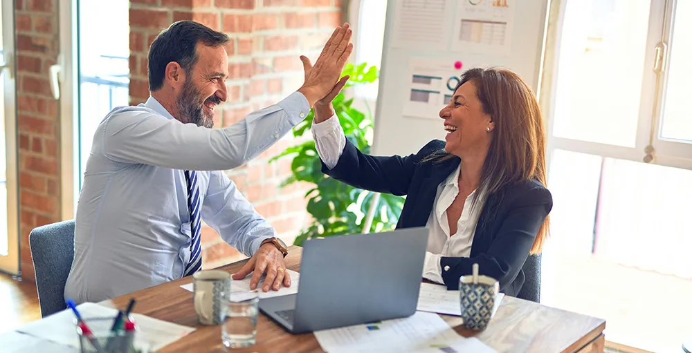 coworkers doing a high five