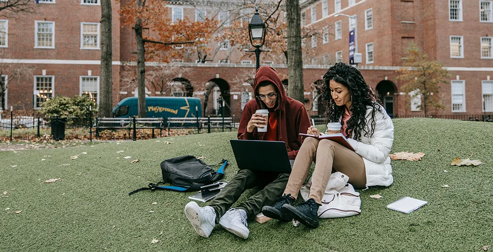 college students studying in park