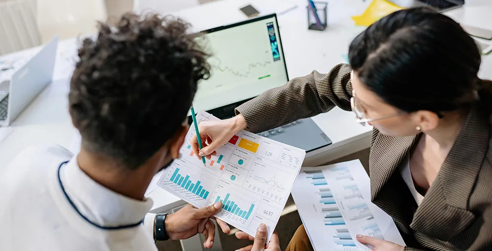 financial advisors looking at graphs