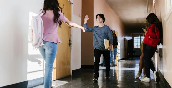 high school students walking in hallway