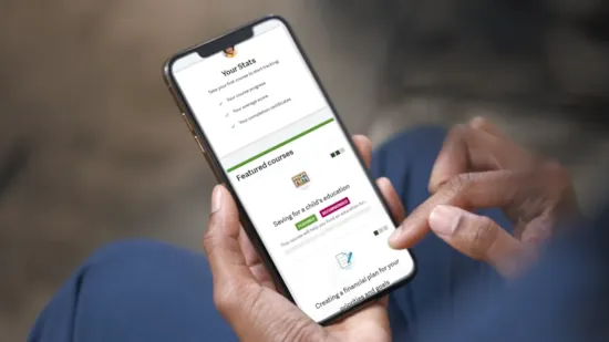 Three devices display the iGrad Enrich financial education dashboard with charts, menus, and user interface elements.