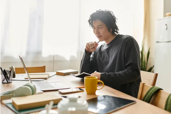 man working on computer at home