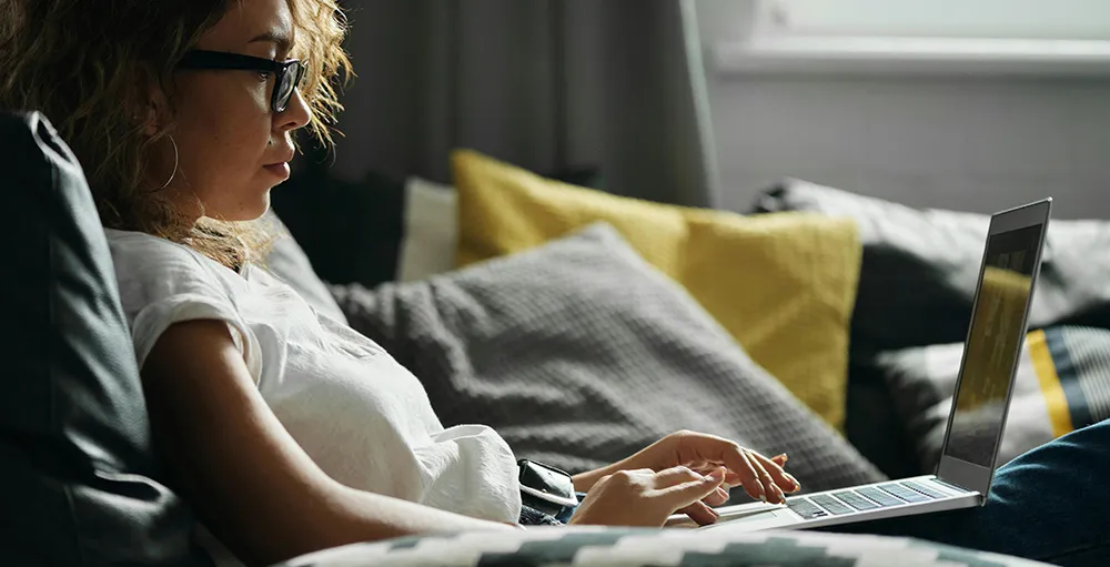 photo of woman using her laptop