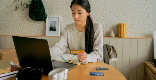 woman checking credit card accounts online