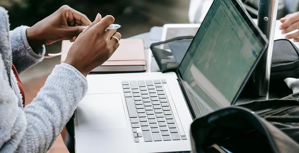 college student working on laptop
