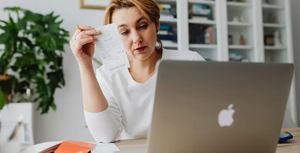 woman calculating her receipts