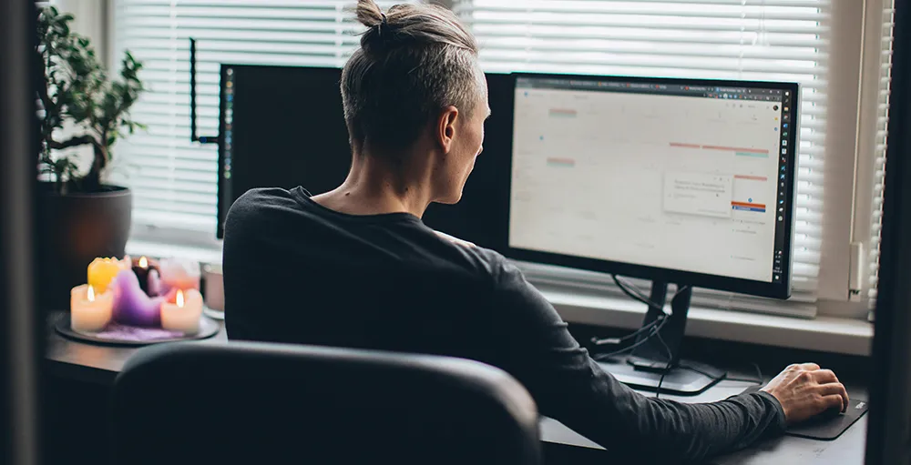 man working from home on computer