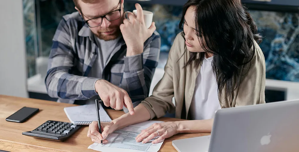 couple calculating all their bills