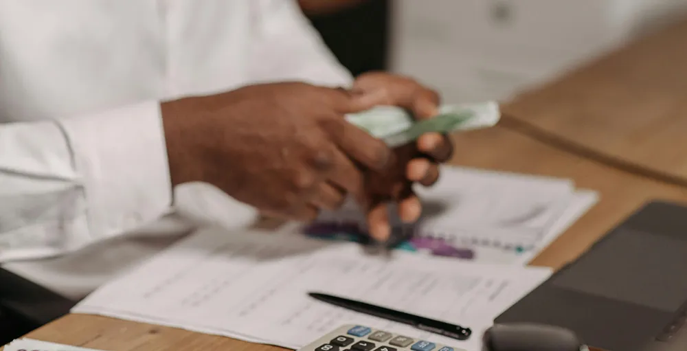 close up shot of a person counting money