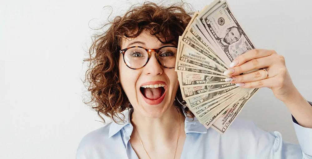 happy student holding money